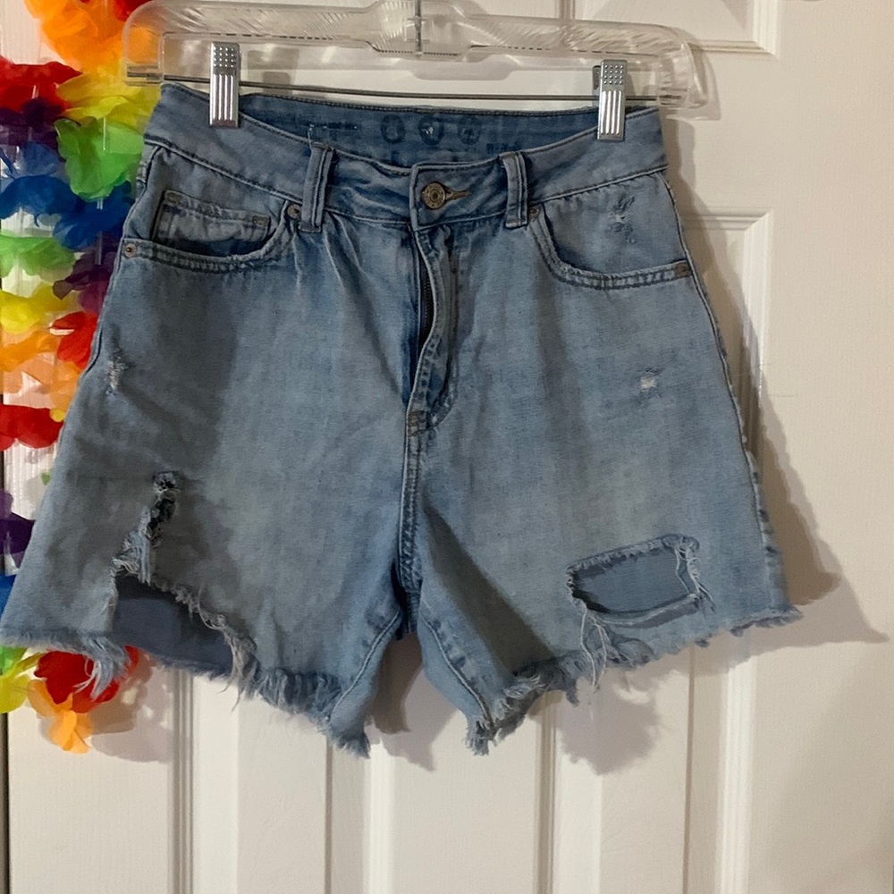 Light wash jean shorts with rips by Rewash